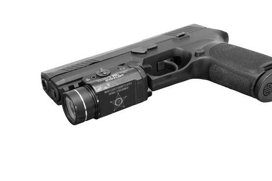 Police trade in 9mm pistol with weapon light, black.